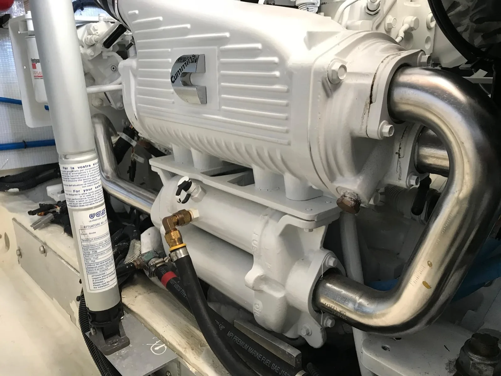 Marine diesel engine showing wiring, sensors and control components