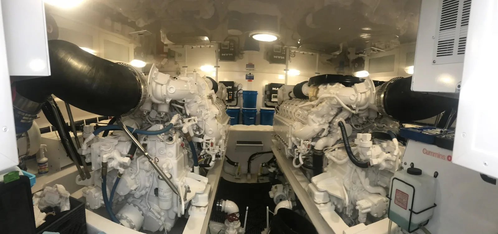 Wide view of a yacht engine room with twin marine diesel engines