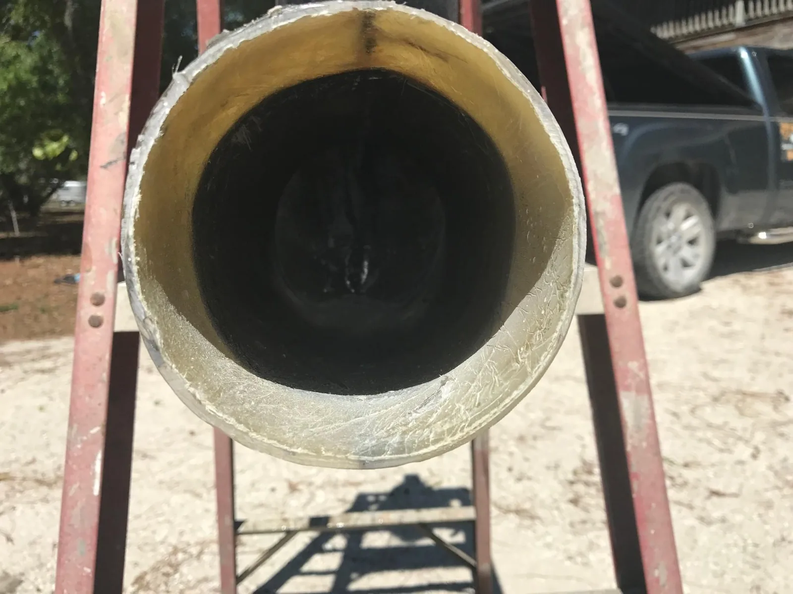 View down a marine exhaust bore showing carbon buildup