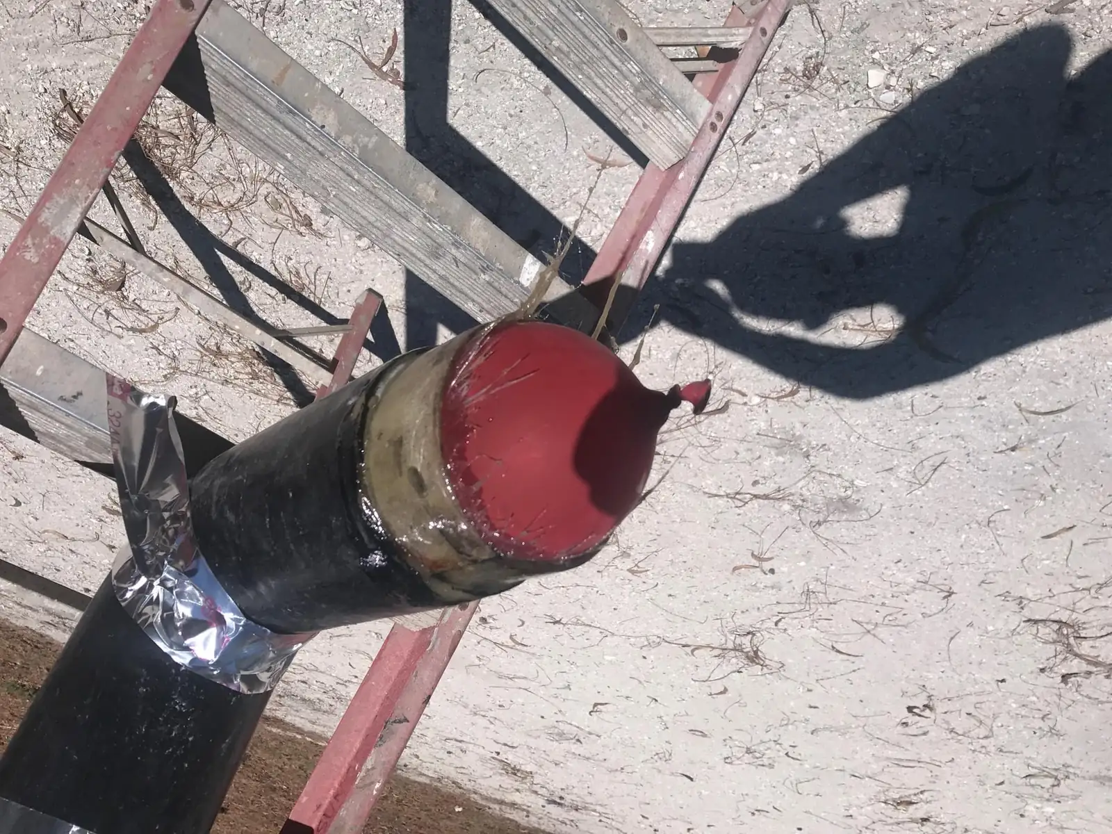 Rusted marine exhaust elbow removed from an engine for replacement