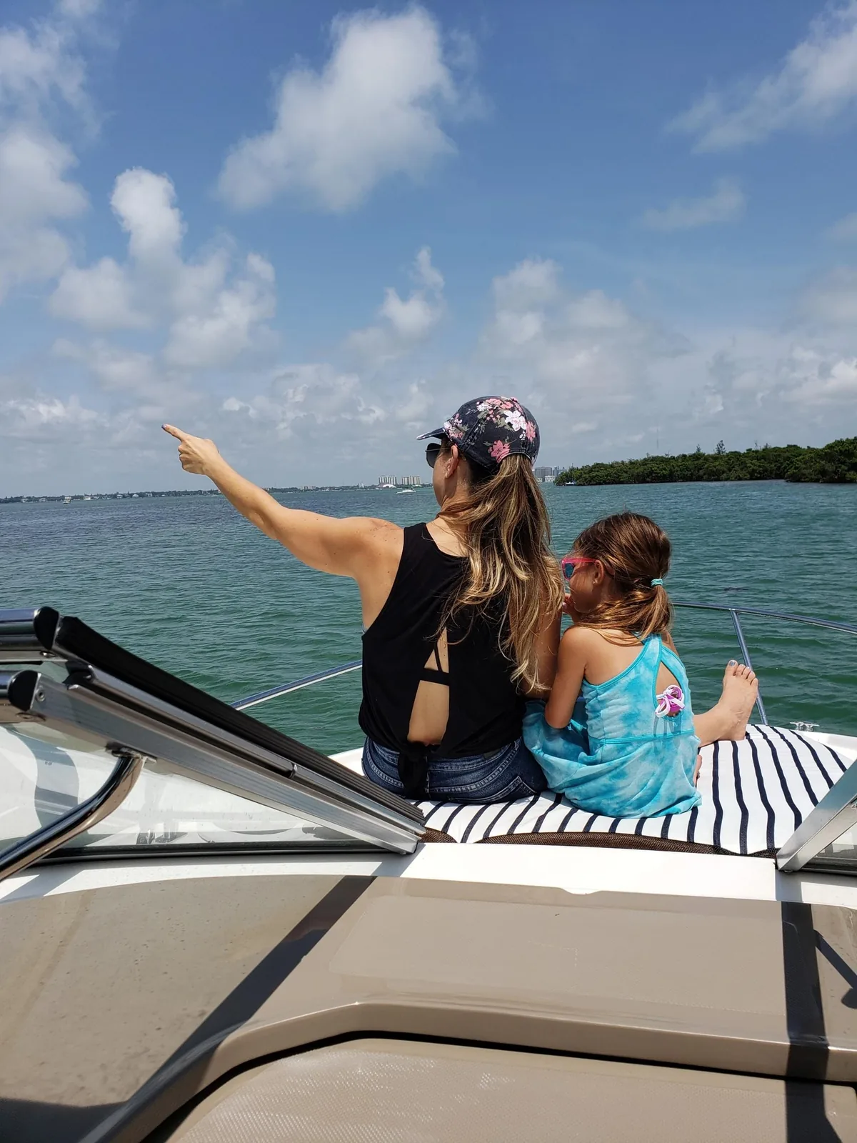 Family enjoying clear water aboard their boat